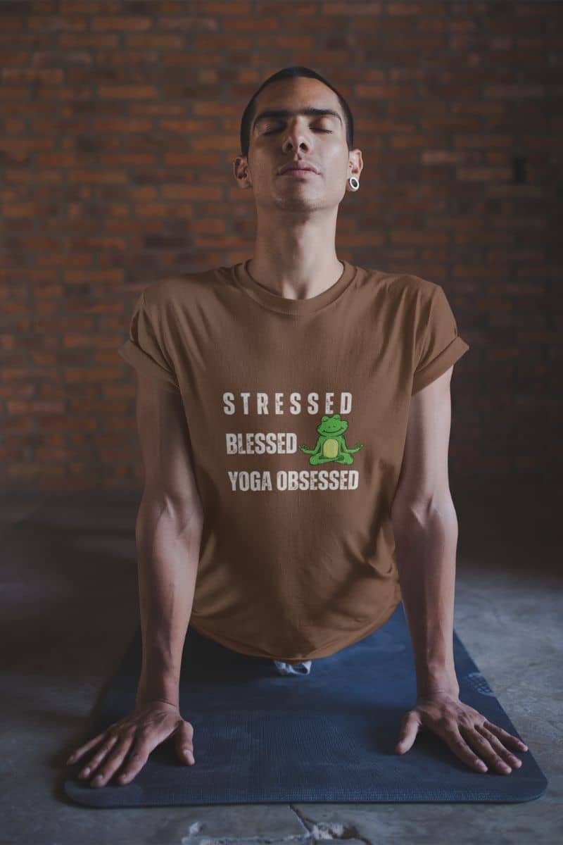 Stressed? blessed, yoga obsessed t-shirt with a guy doing yoga on a mat in the room