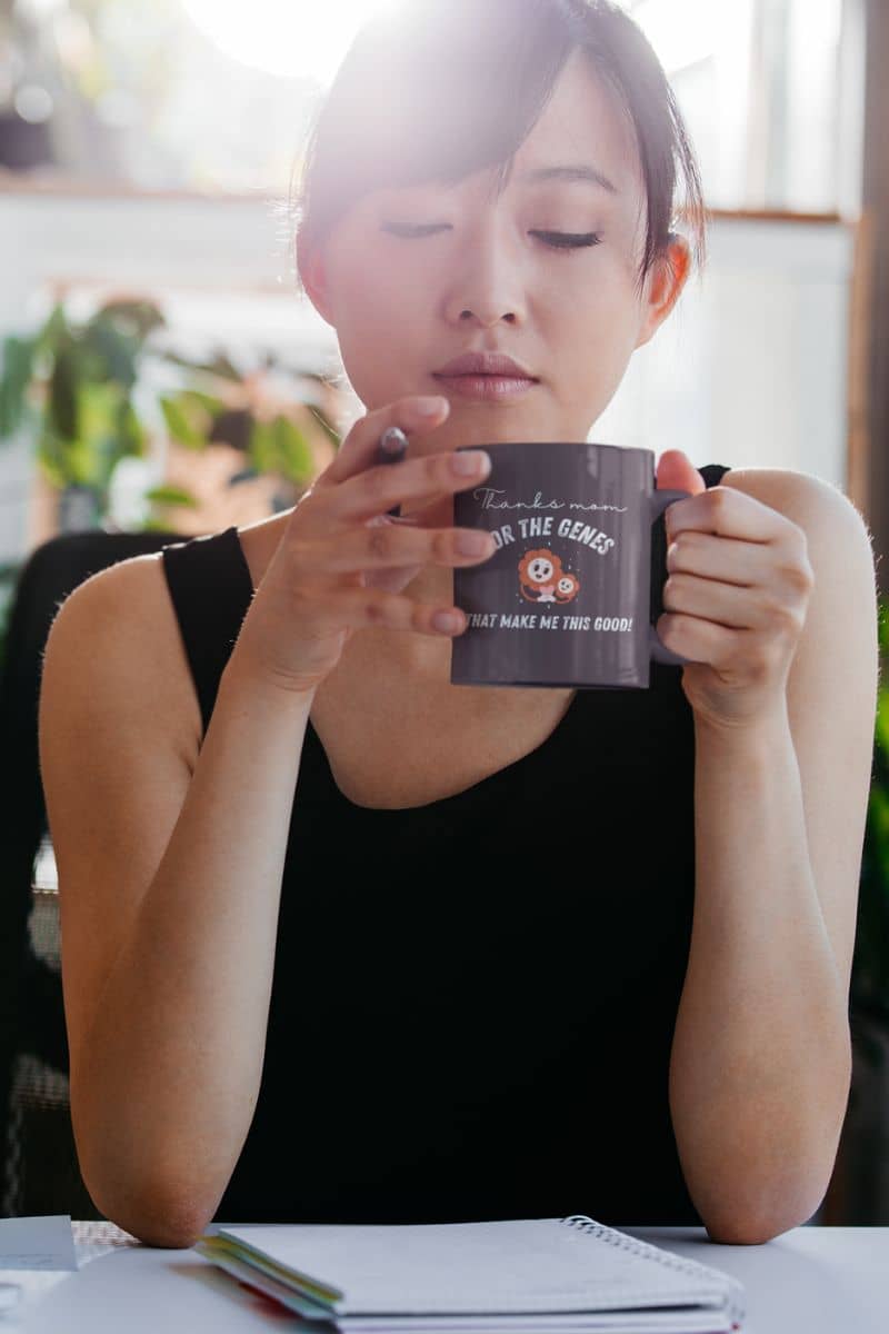Unique mug with a girl working but still holding a pen and a cup in her hand