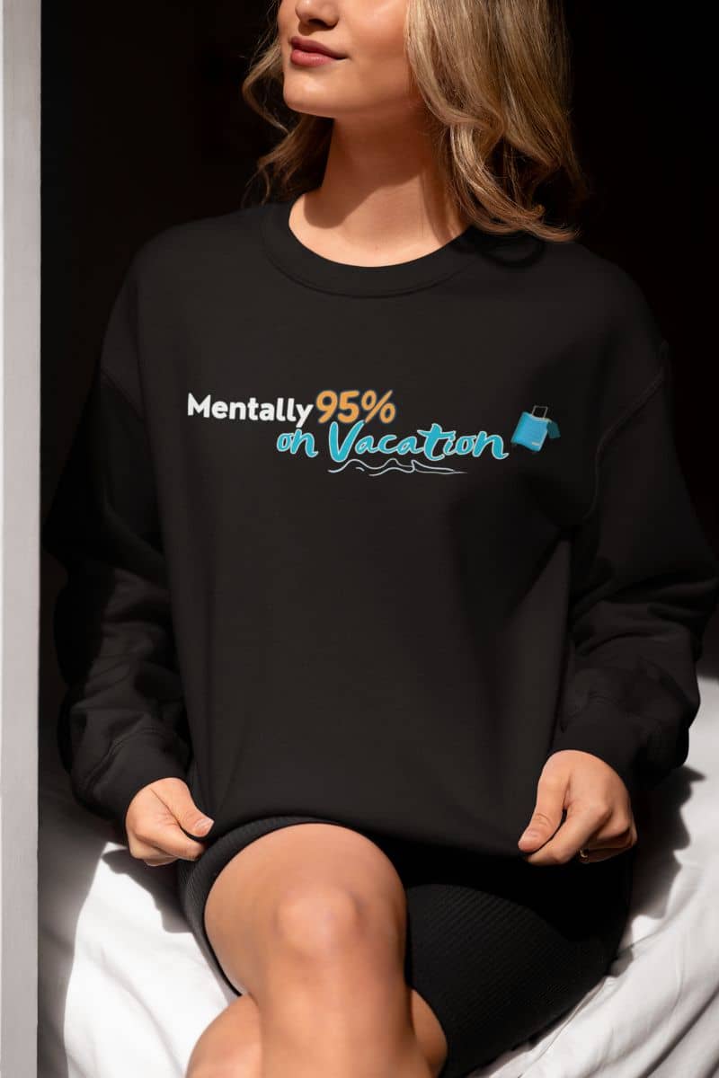 Wanderlust sweatshirt with a person wearing a black sweatshirt with text and graphics