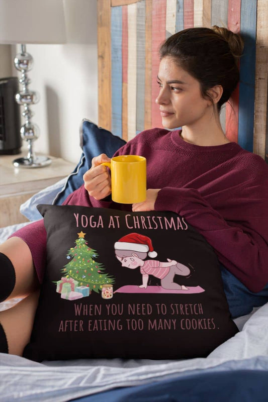 When You Need To Stretch After Eating Too Many Cookies Pillow with a girl hugging a pillow and looking out the window while holding a glass of water