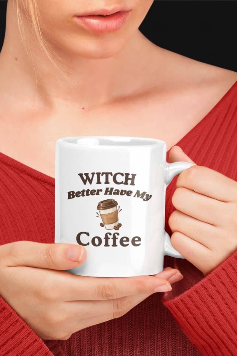 Witchy coffee mug with a person holding a white ceramic mug featuring the text 'Witch Better Have My Coffee' and a small coffee cup graphic.