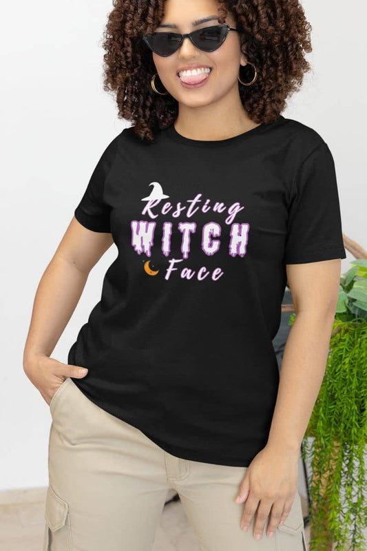 Witchy graphic t-shirt with a woman in a black t-shirt with 'Resting Witch Face' text.
