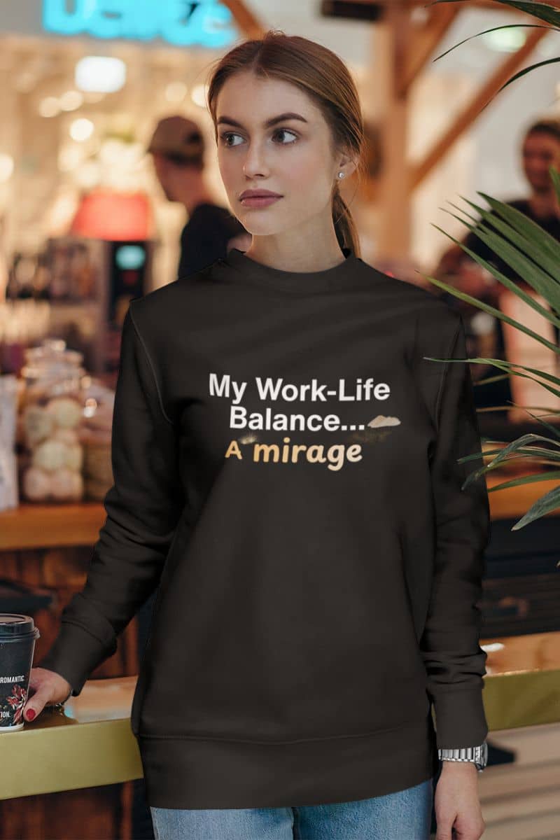 Work-life balance sweatshirt with a woman wearing a black sweatshirt with text in a casual setting
