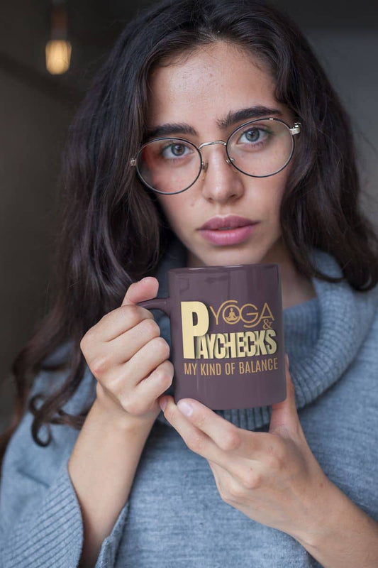 Yoga and paychecks mug with a beautiful girl wearing glasses holding a cup of coffee in her hand
