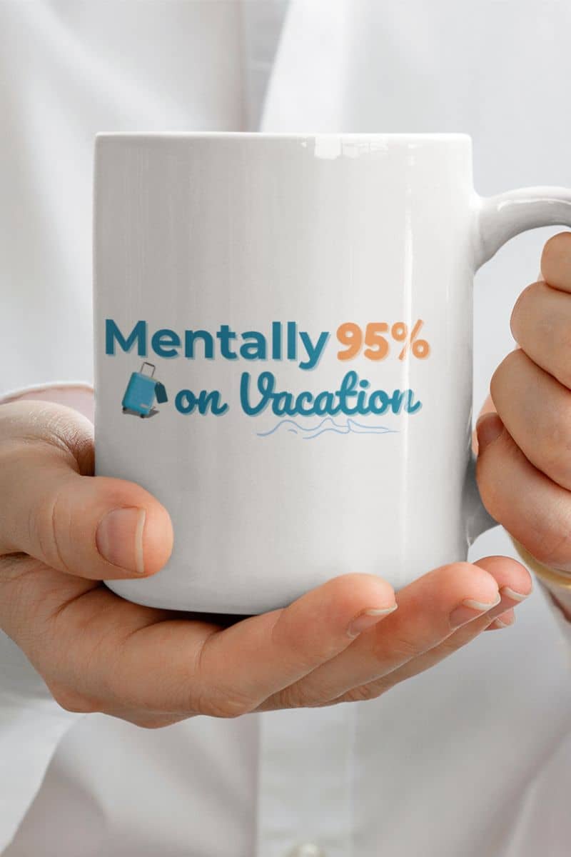 beach vibes ceramic mug with a mug with 'Mentally 95% on Vacation' text held by a person