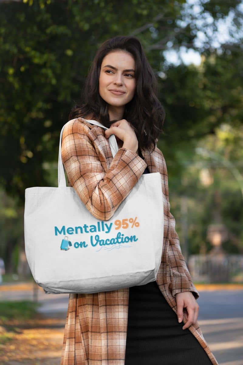 beach vibes tote with a woman holding a tote bag with text 'Mentally 95% on Vacation' outdoors