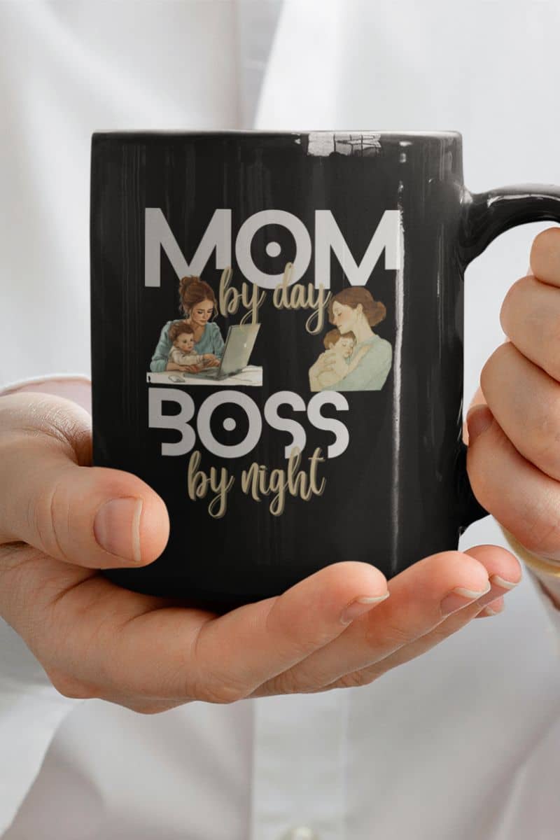 best mom mug gift with a black mug with 'Mom by day, Boss by night' text and images of a mother and child holding a laptop.