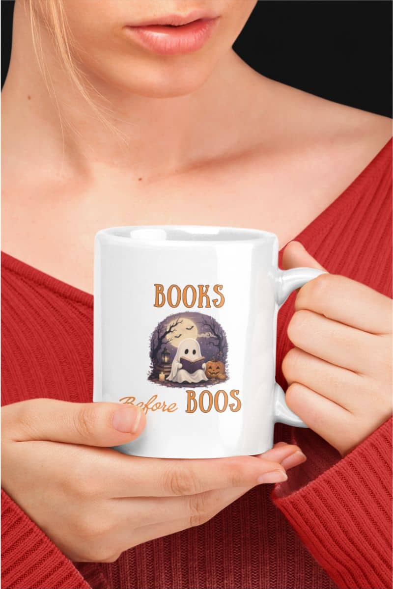 book lover mug with a person holding a mug with text 'Books Before Boos'