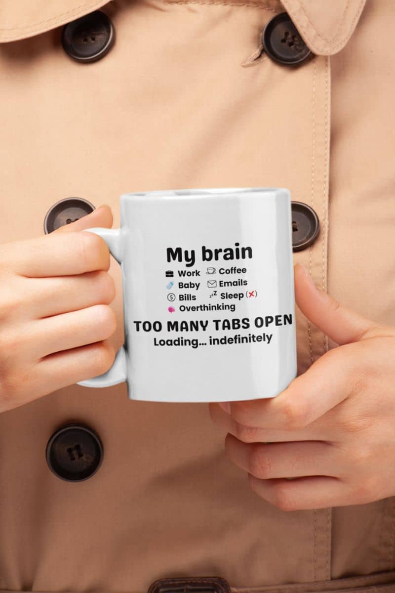 burnout coffee mug with a person holding a mug with text 'My Brain Has Too Many Tabs Open. Loading… indefinitely.'