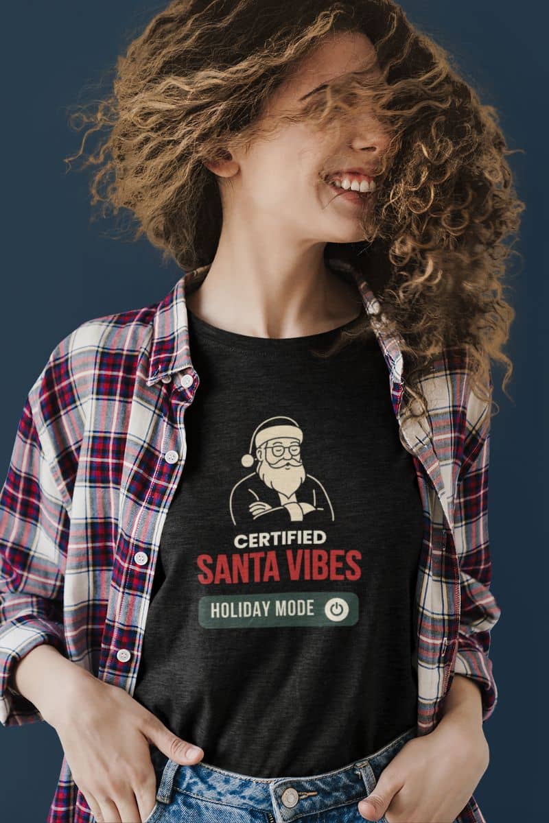 casual christmas outfit with a person wearing a black t-shirt with 'Certified Santa Vibes – Holiday Mode On' design, standing against a dark background.