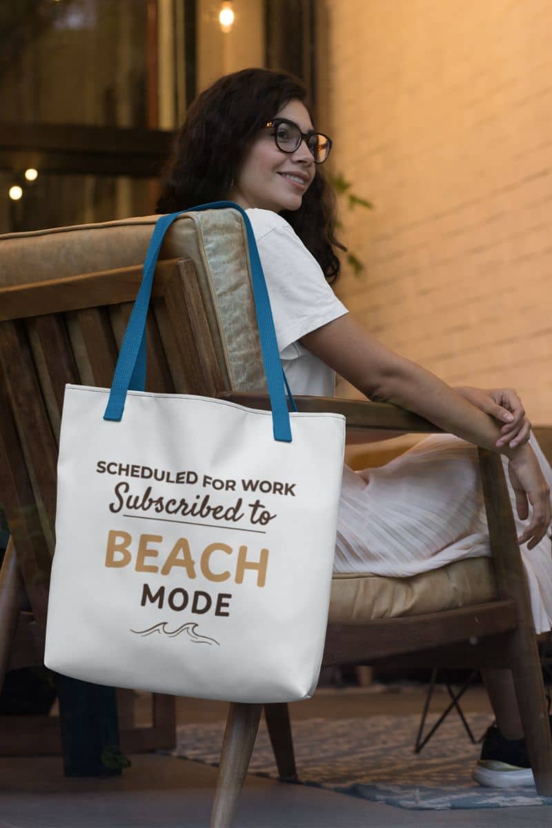 casual summer tote with a woman sitting on a chair holding a tote bag with text 'Scheduled for work, Subscribed to Beach Mode'.