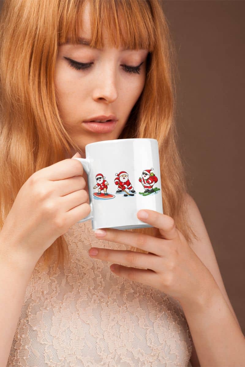 christmas sports mug with a woman holding a mug with cartoon Santa Claus designs against a brown background