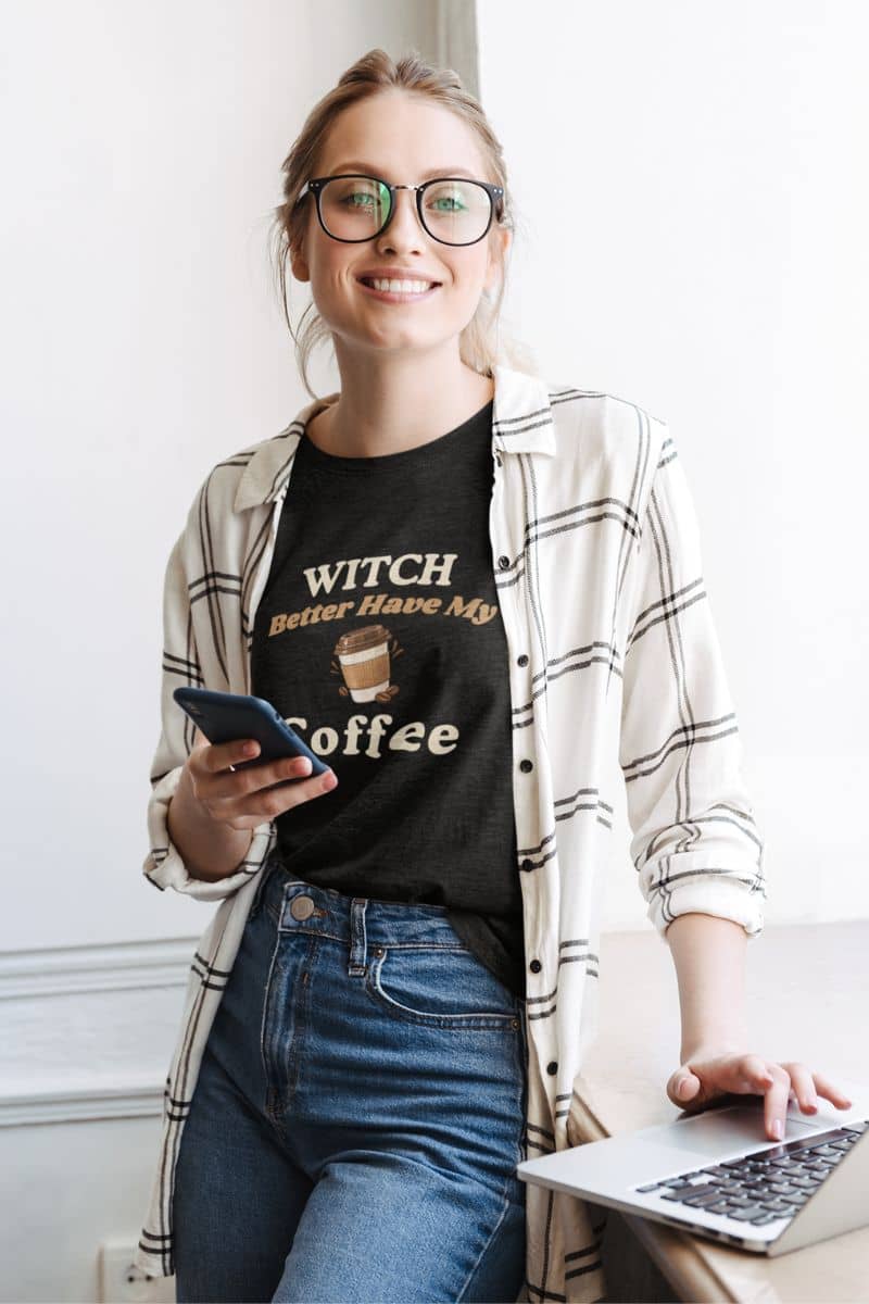 coffee lover Halloween shirt with a woman wearing a black graphic t-shirt that reads 'Witch Better Have My Coffee'