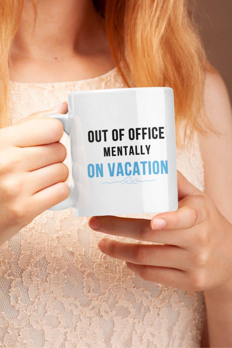 coffee mug for coworkers with a person holding a mug with text 'Out of Office Mentally On Vacation' 