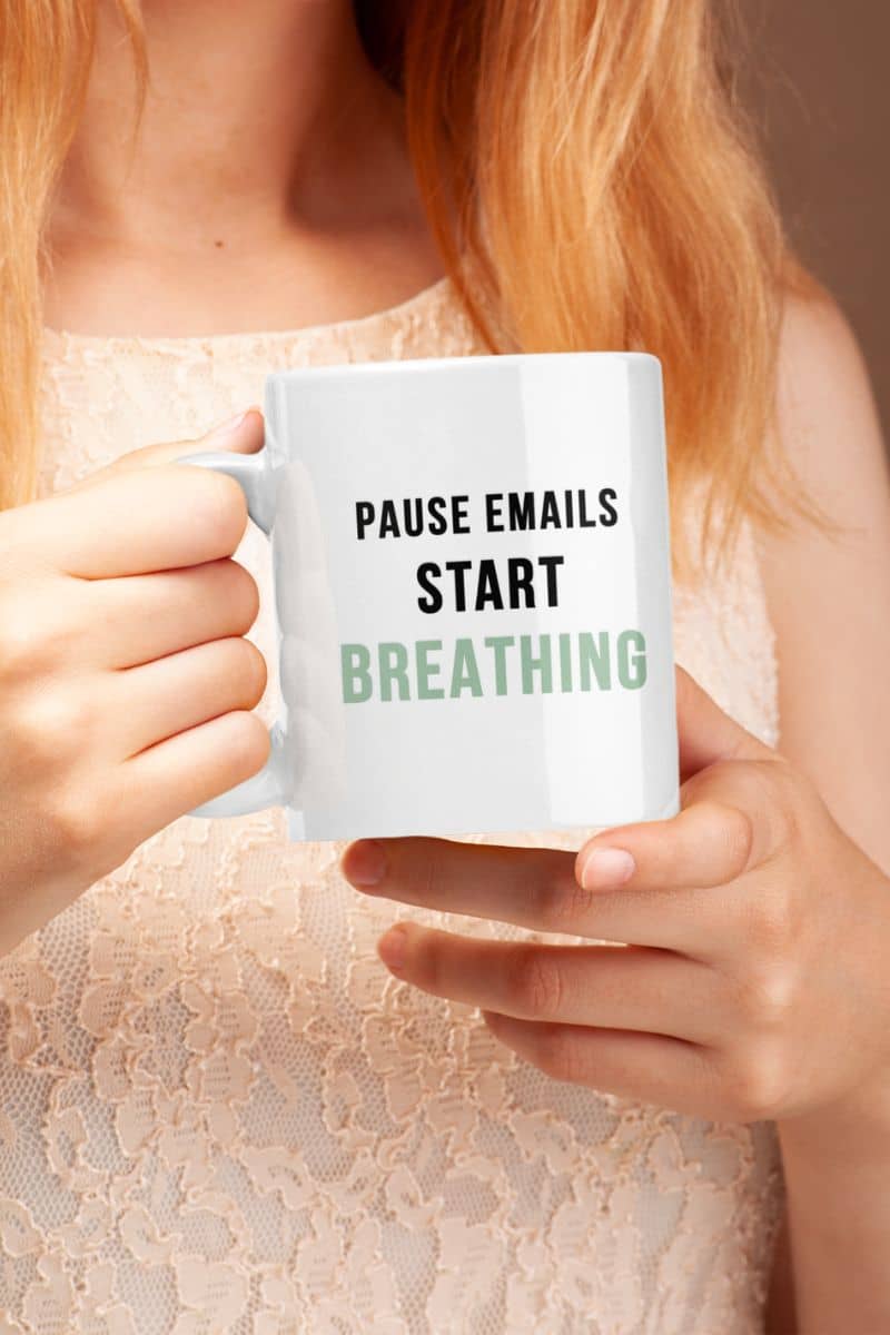coffee mug for stress relief with a person holding a mug with text 'Pause Emails Start Breathing' 