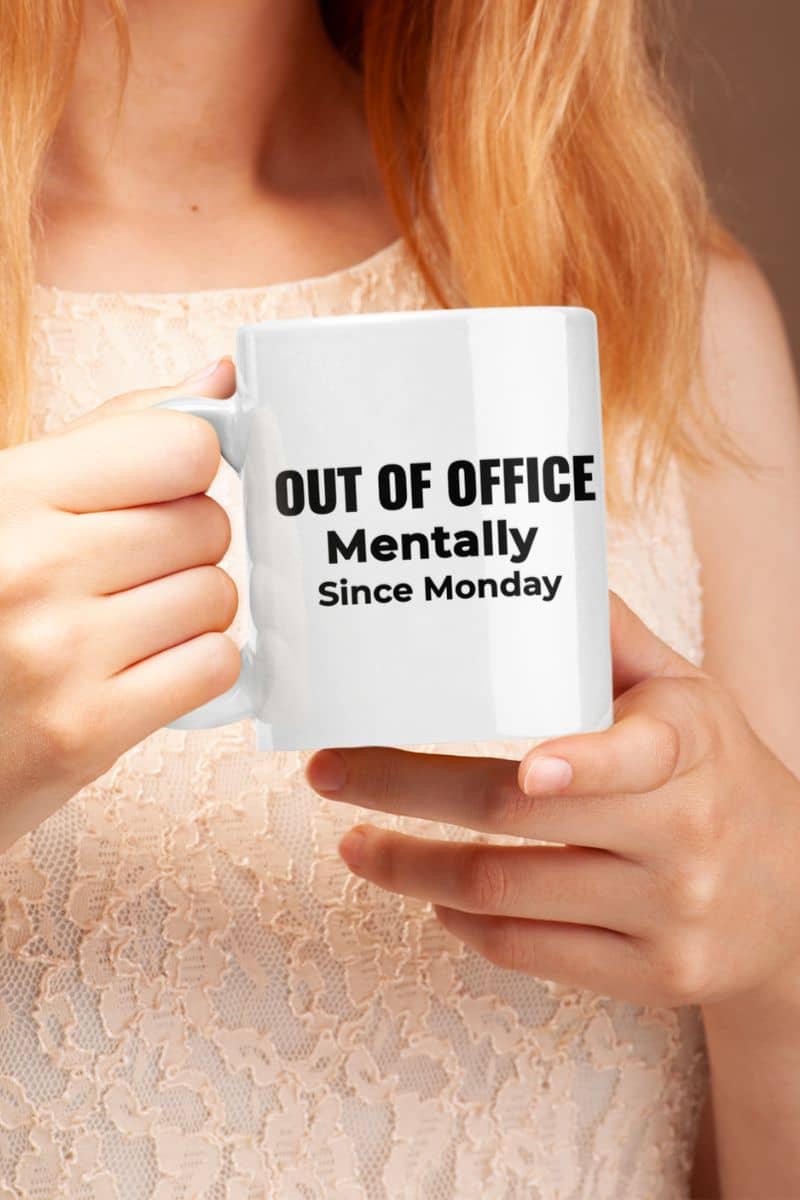 coworker gift mug with a person holding a mug with text 'Out of Office. Mentally Since Monday.'
