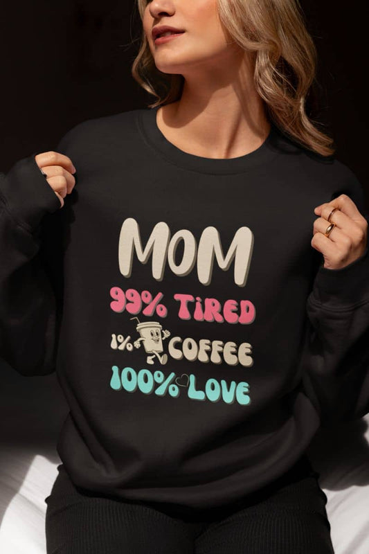 cozy mom sweatshirt with a person wearing a black sweatshirt with text 'Mom 99% Tired, 1% Coffee, 100% Love'