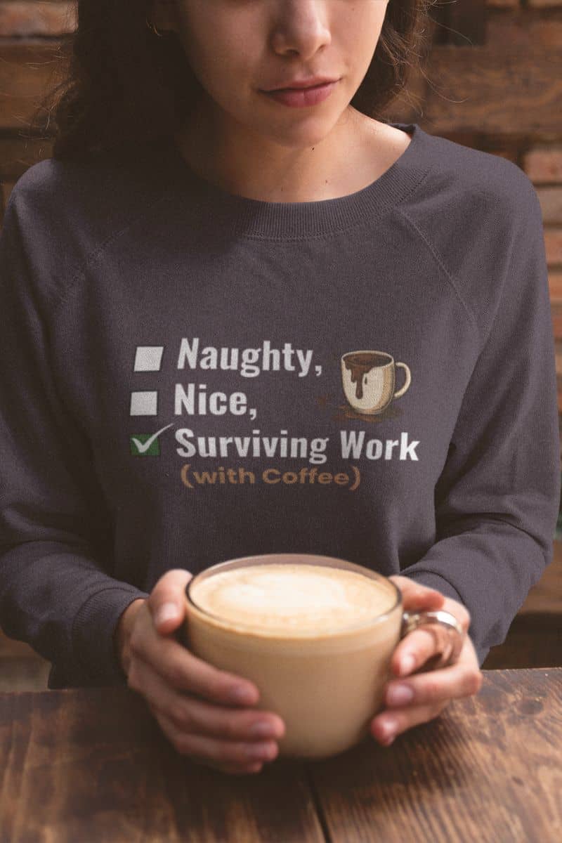 cozy office sweatshirt with a person wearing a sweatshirt with a coffee-themed message, holding a cup of coffee.