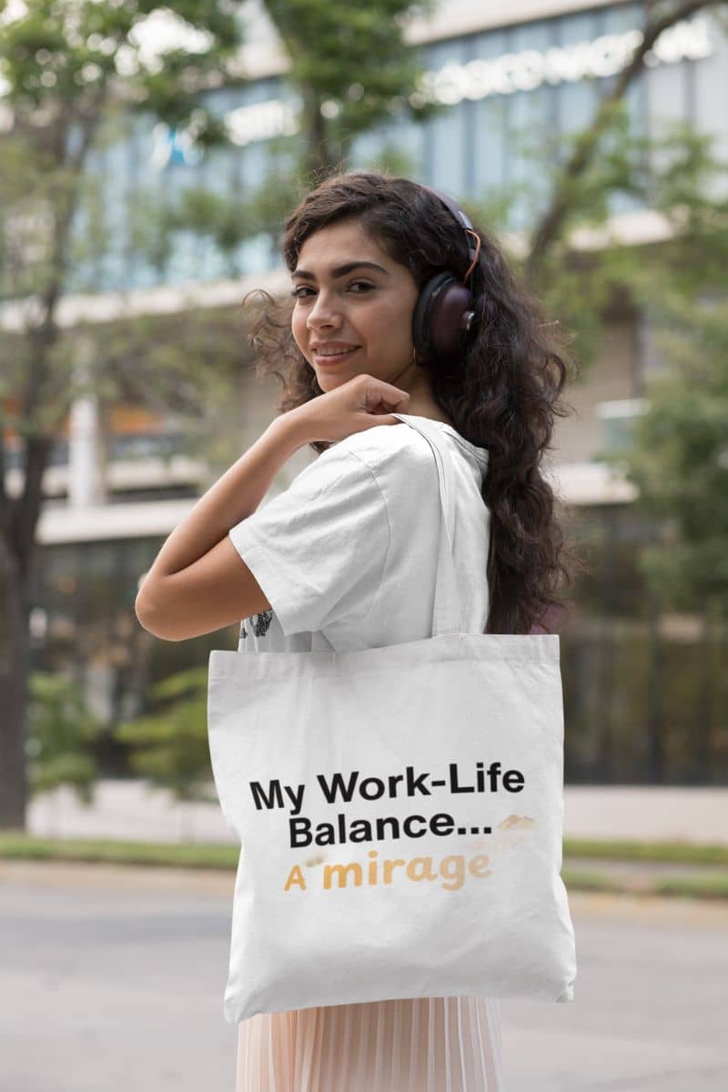 desert mirage theme tote with a woman holding a tote bag with 'My Work-Life Balance... A Mirage' text in an urban setting.