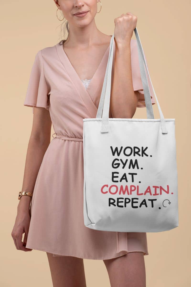 durable cotton tote with a woman holding a tote bag with humorous text on a beige background