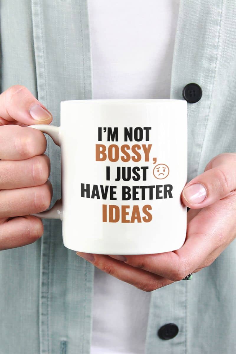 female entrepreneur mug with a person holding a mug with text 'I'm not bossy, I just have better ideas' against a light gray background.