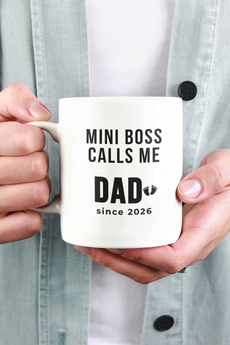 first time dad mug with a person holding a mug with text 'Mini boss calls me Dad since 2026' 