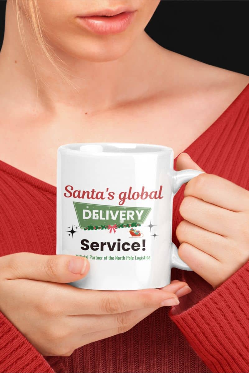 funny Christmas mug with a person holding a mug with 'Santa's global delivery service' text
