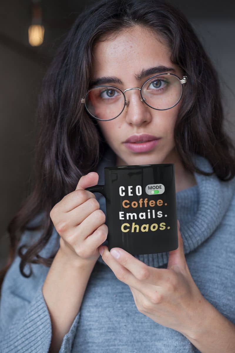 funny boss gift mug with a girl holding a black mug with text 'CEO Mode: Coffee. Emails. Chaos.'
