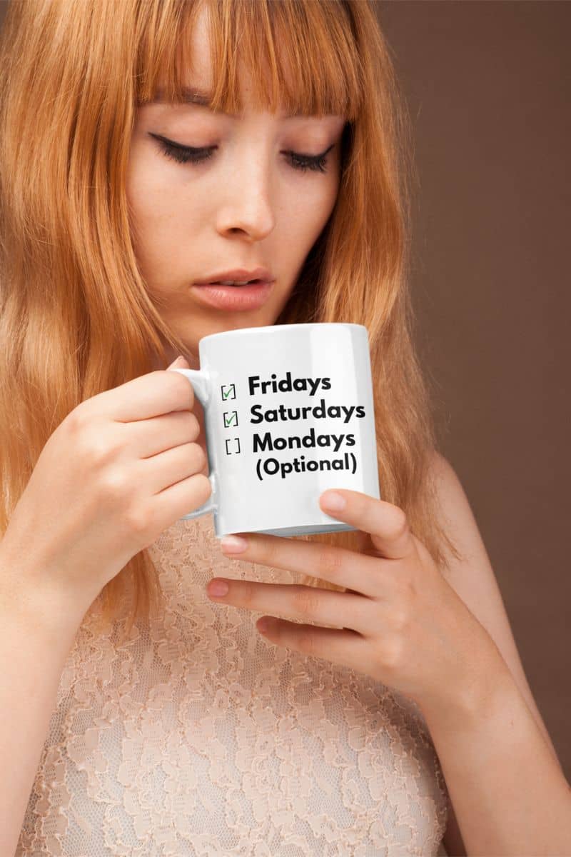 funny office coffee mug with a woman holding a mug with text about workdays on a plain background