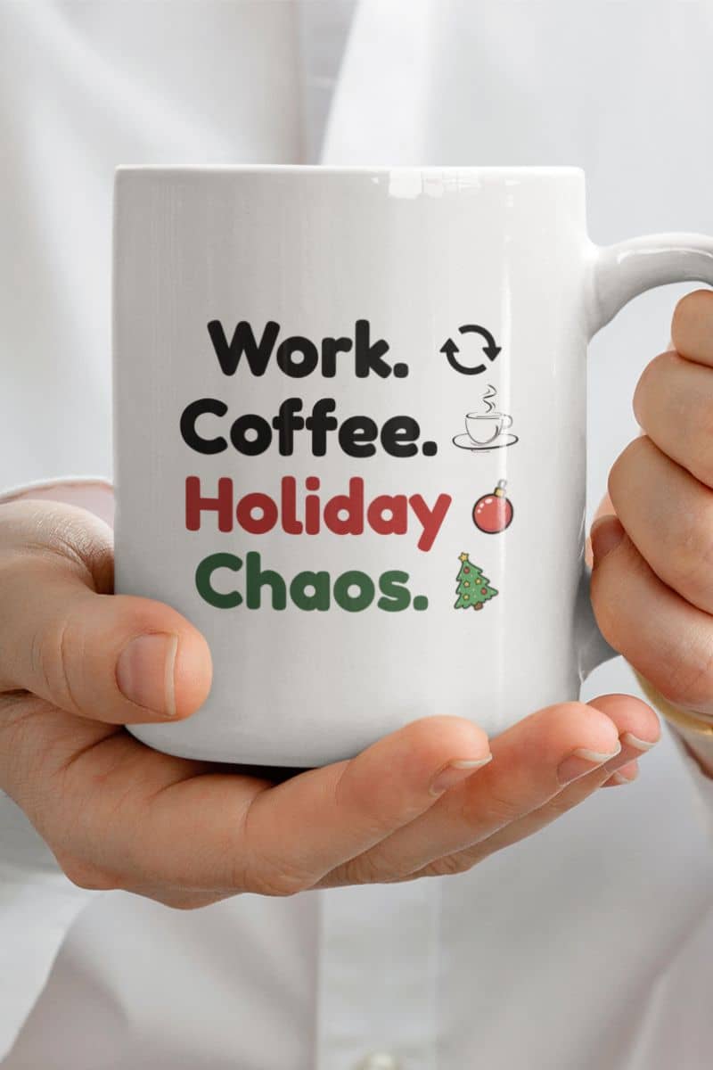 funny office holiday mug with a white mug with text 'Work. Coffee. Holiday Chaos.' held by a person.
