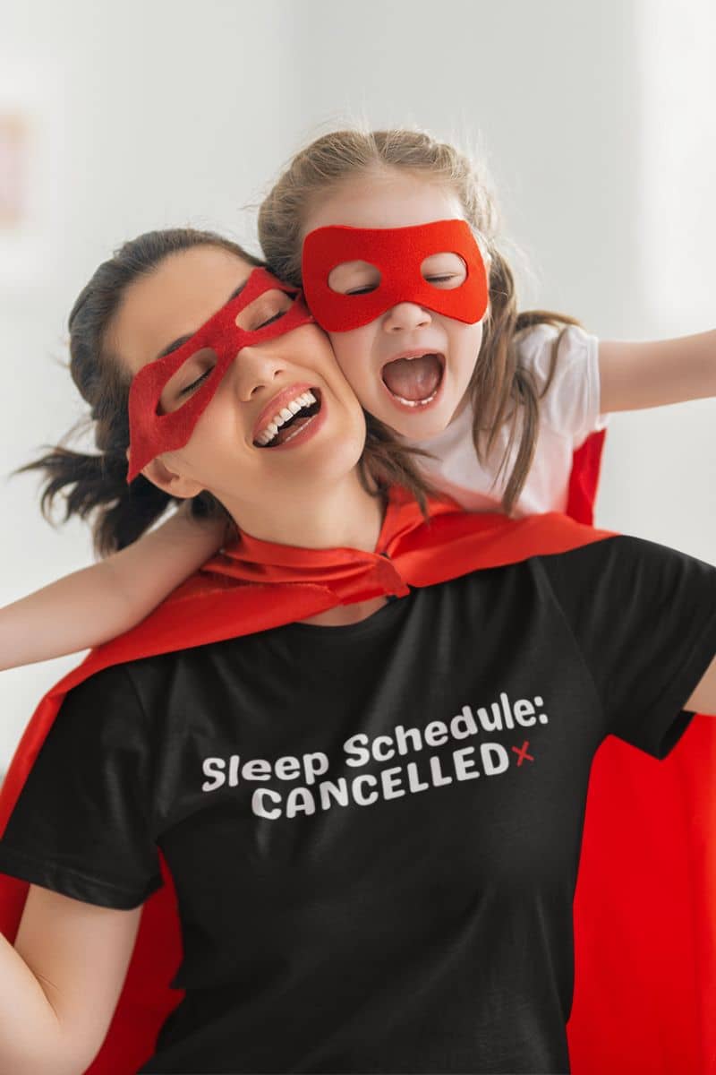 funny tired shirt with two people wearing superhero masks and capes with a person in a black t-shirt with text.