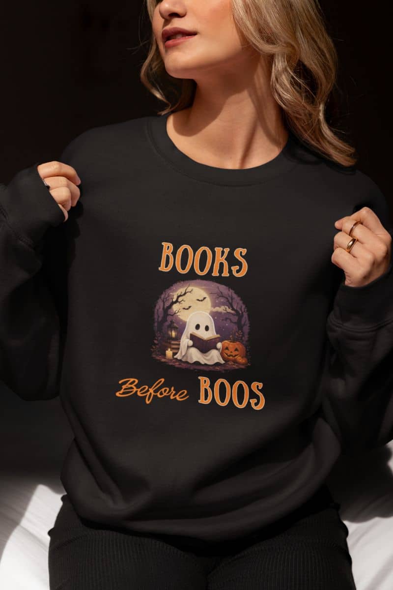 halloween sweatshirt with a woman wearing a sweatshirt featuring the text 'Books Before Boos'