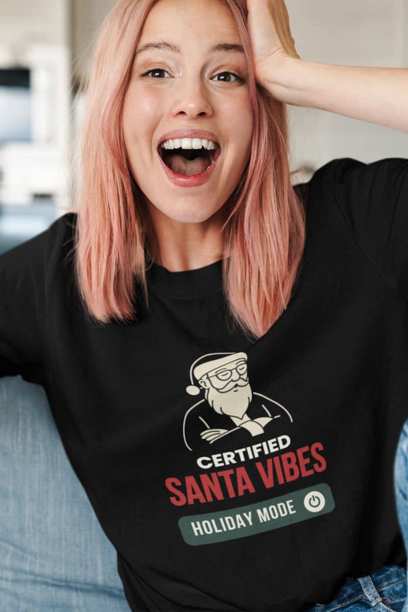 holiday mode christmas tee with a person wearing a black t-shirt with 'Certified Santa Vibes – Holiday Mode On' design