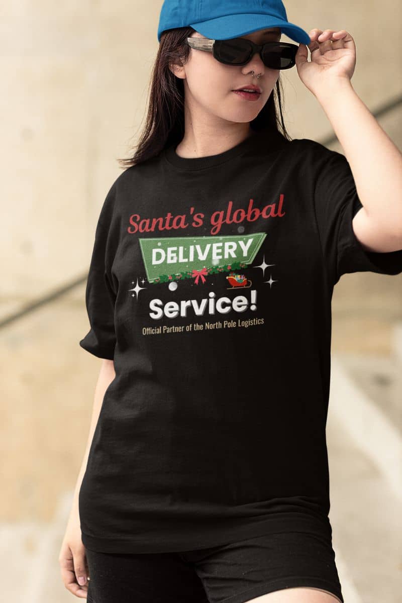 holiday party shirt with a person wearing a black t-shirt with 'Santa's global delivery service' text and graphics.