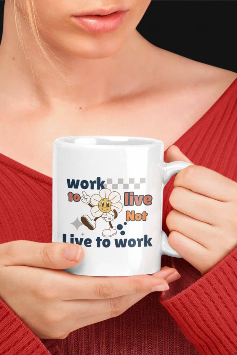 inspirational coffee mug with a person holding a mug with a motivational quote 'Work to Live, Not Live to Work' and cartoon character design.
