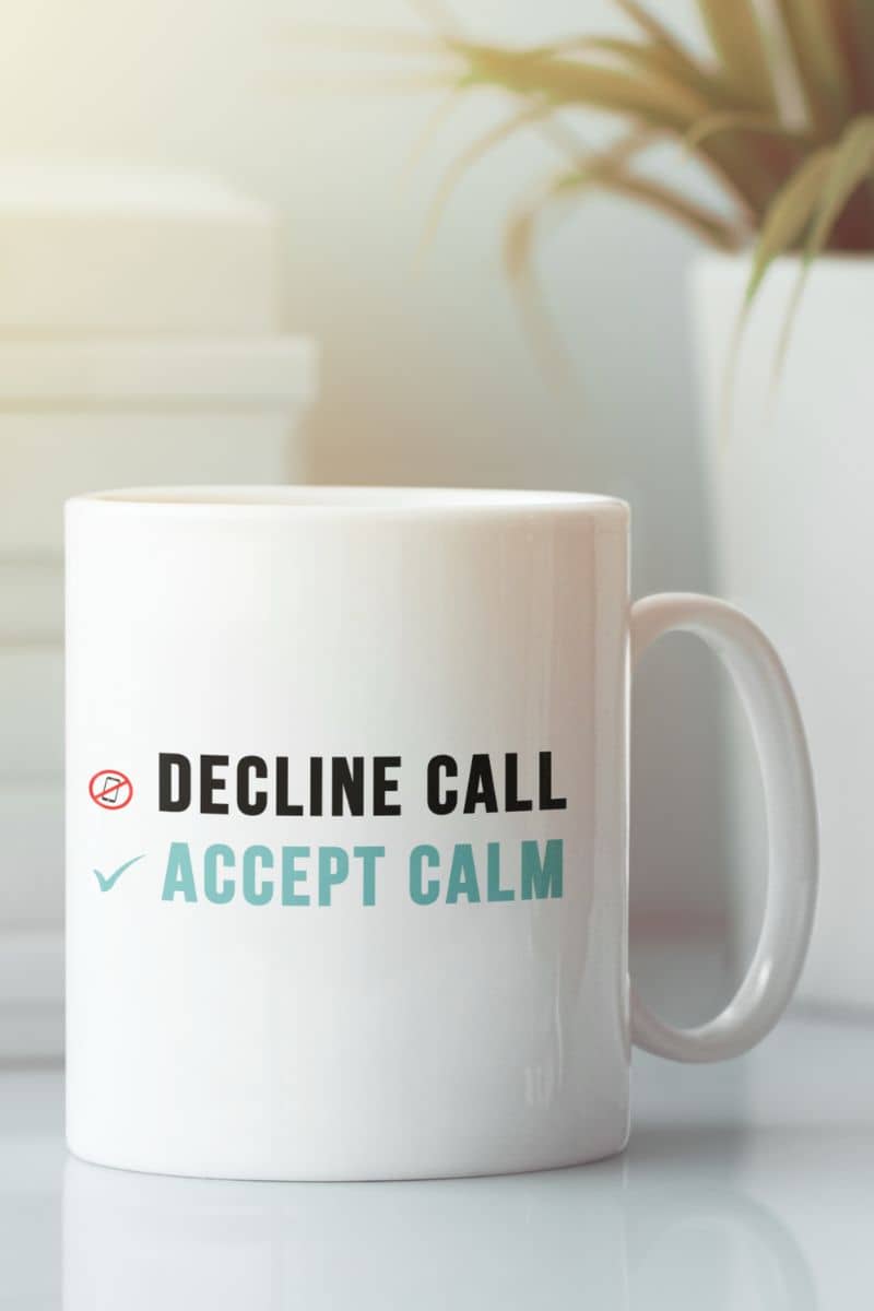 mindfulness coffee mug with a white mug with text 'Decline Call Accept Calm' on a light background