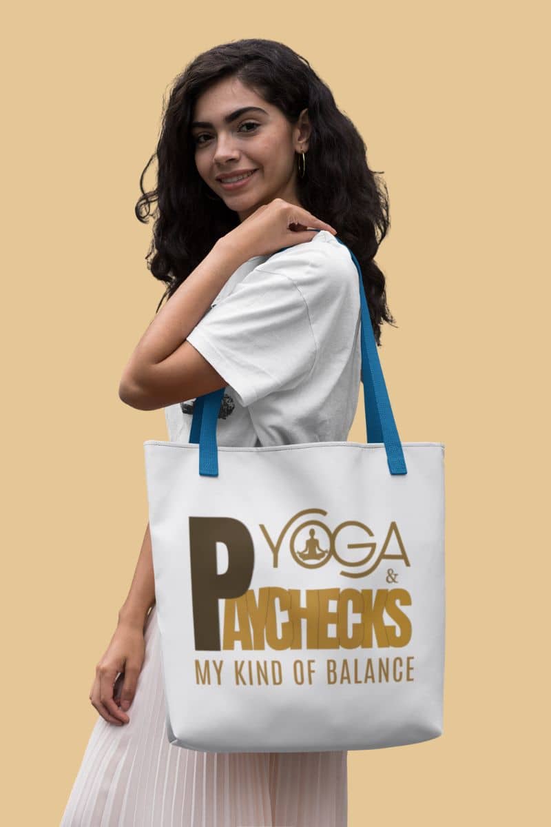 mindfulness gift tote with a woman holding a tote bag with 'Yoga & Paychecks My Kind of Balance' text on a beige background