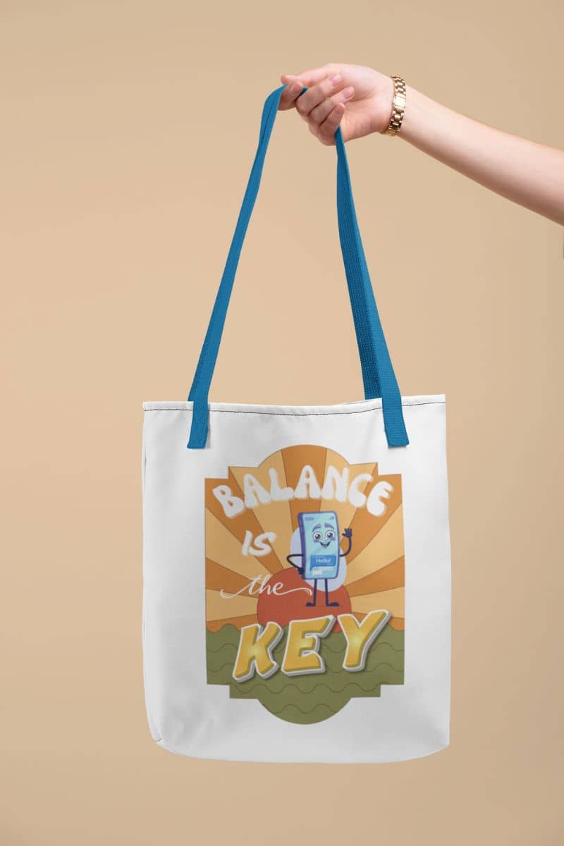 mindfulness tote bag with a tote bag with 'Balance is the Key' design held by a hand against a beige background