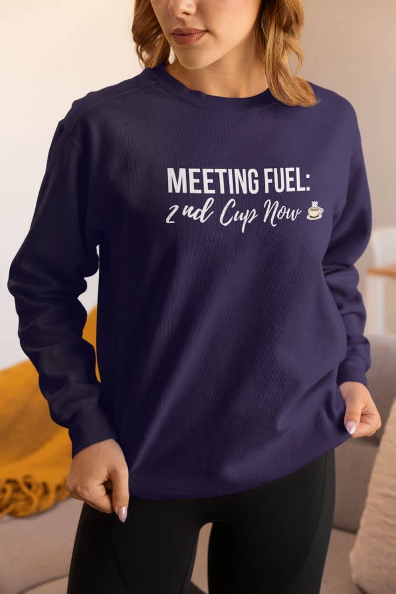 morning coffee pullover with a person wearing a purple sweatshirt with text in a casual setting