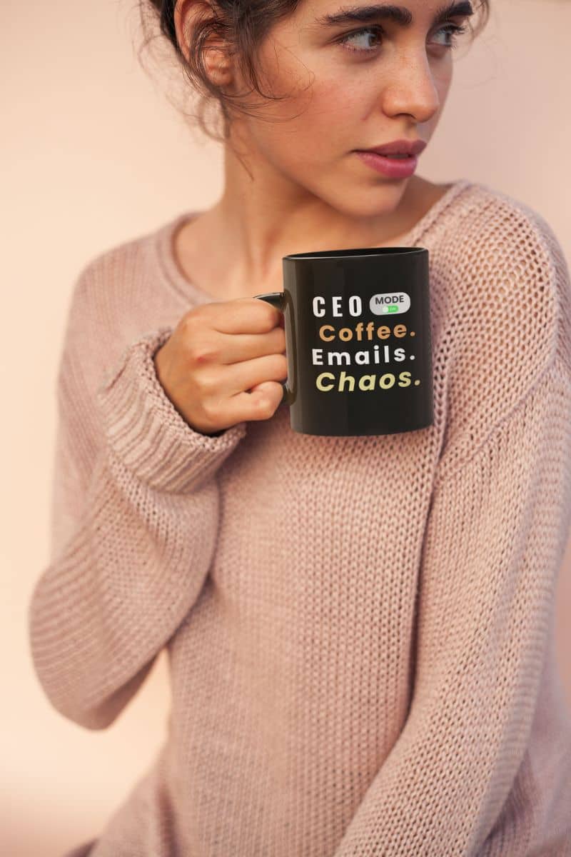 motivational office mug with a girl holding a black mug with text 'CEO Mode: Coffee. Emails. Chaos.'