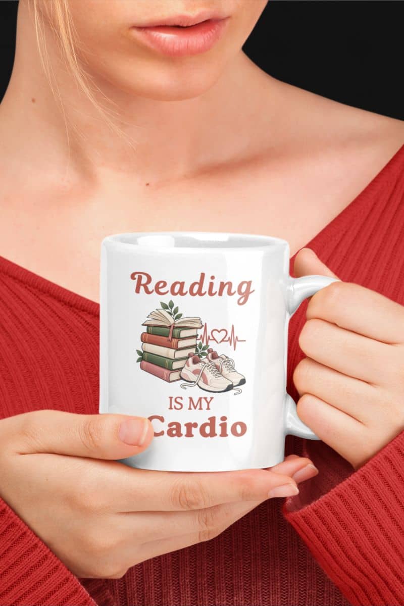 mugs for readers with a person holding a white ceramic mug with the printed phrase 'Reading IS My Cardio'