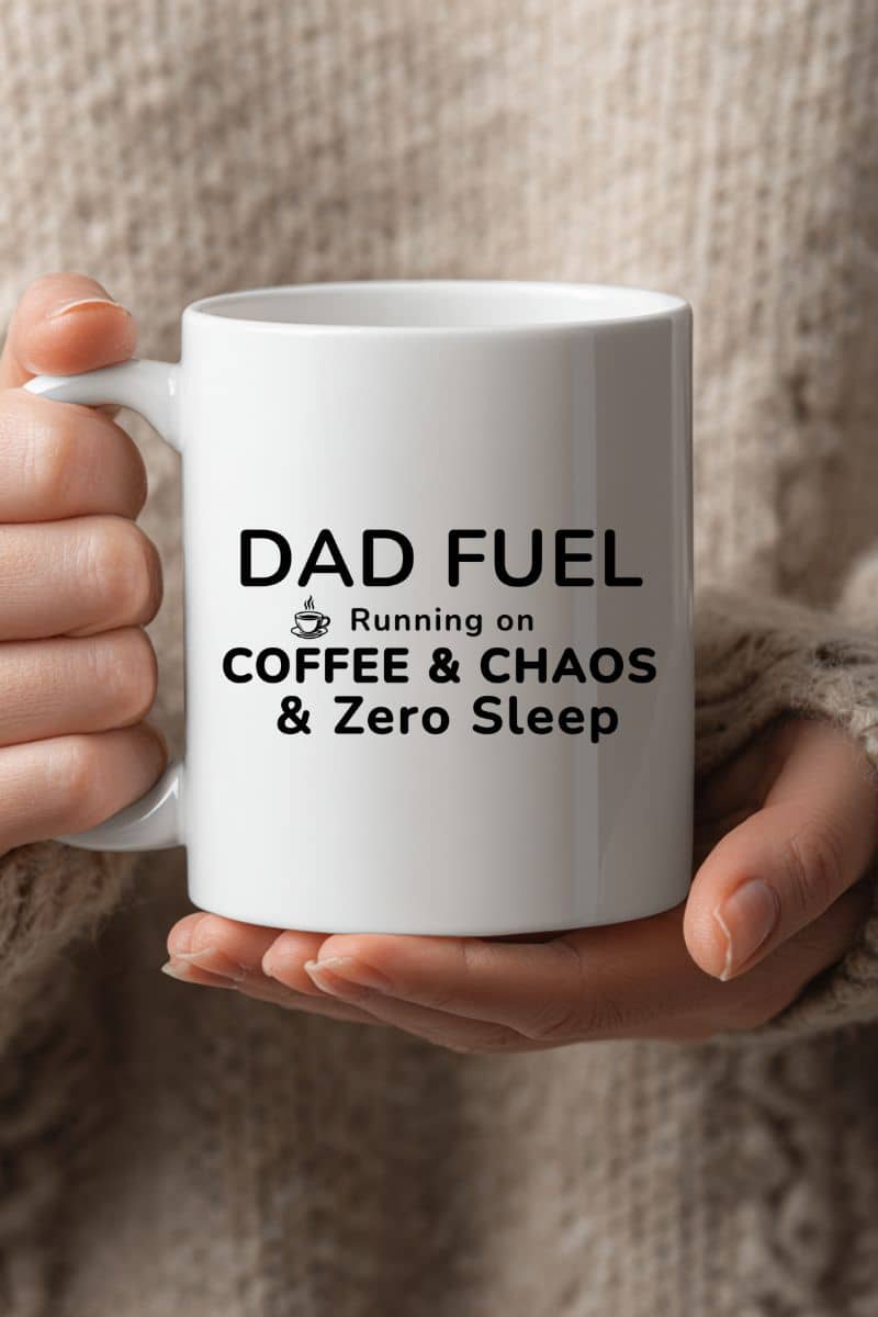 new dad humor mug featuring a white mug with text 'DAD FUEL Running on COFFEE & CHAOS & Zero Sleep' held by a person.