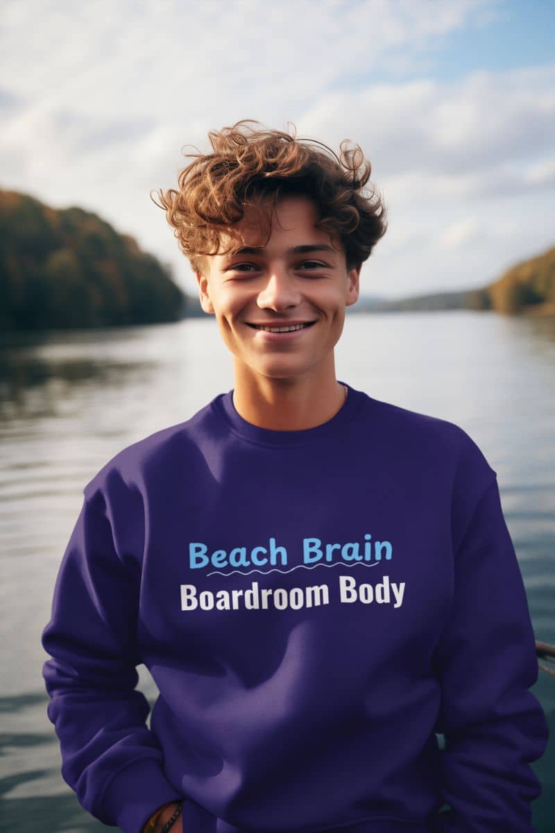 ocean breeze sweater with a person wearing a purple sweatshirt with text by a lake