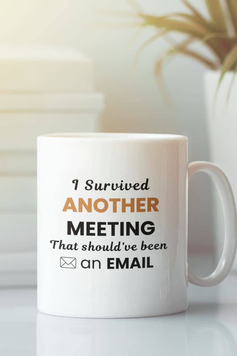 office coffee mug with a white mug featuring the  text 'I Survived Another Meeting That Should’ve Been an Email'