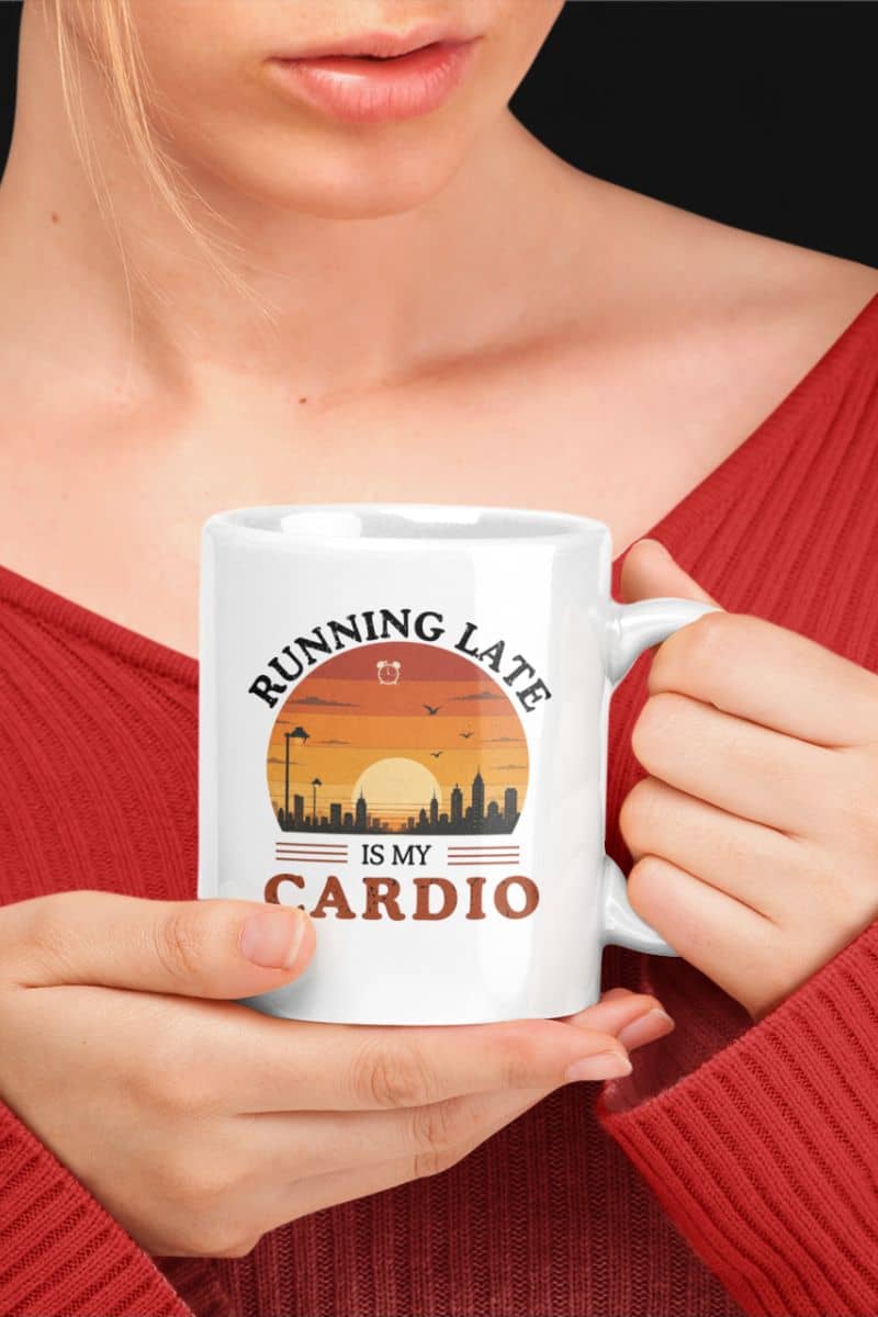 office coffee mug with a person holding a mug with 'Running late is my cardio' design