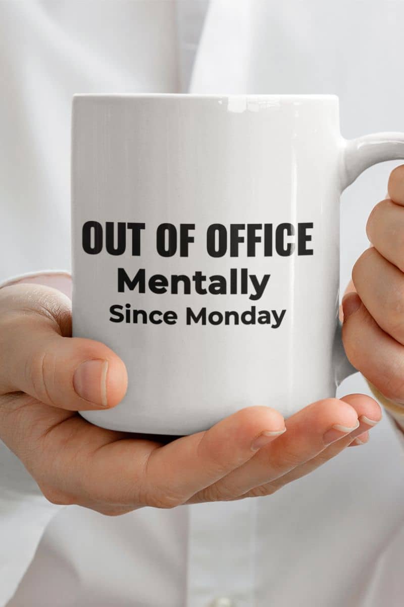 office humor mugs with a person holding a  mug with text 'Out of Office. Mentally Since Monday.'
