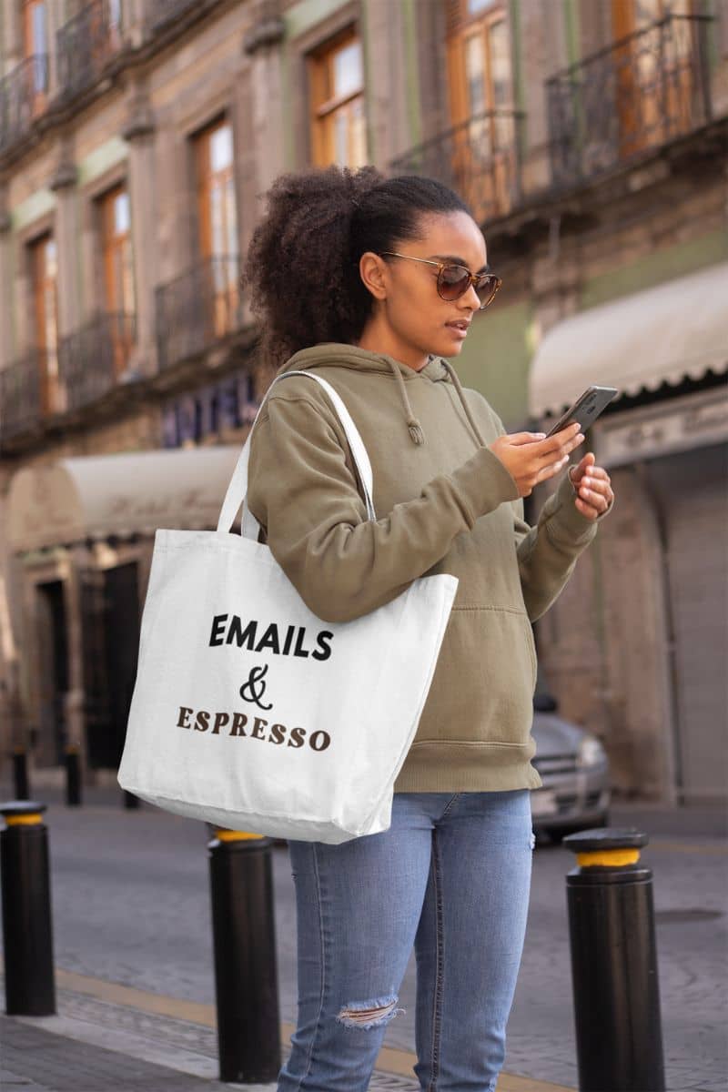 office tote bag with a woman holding a phone and a tote bag with text 'Emails & Espresso' in an urban setting