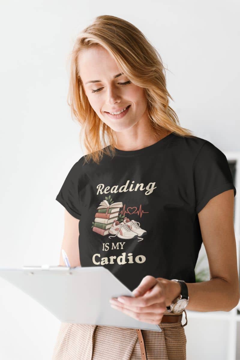 reading themed t shirts with a woman  wearing a black graphic t-shirt that reads 'Reading is my Cardio' 