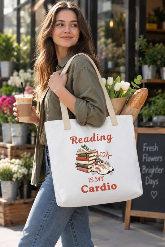 reading tote with a woman carrying a white tote bag featuring the text 'Reading Is My Cardio', standing in a flower shop.