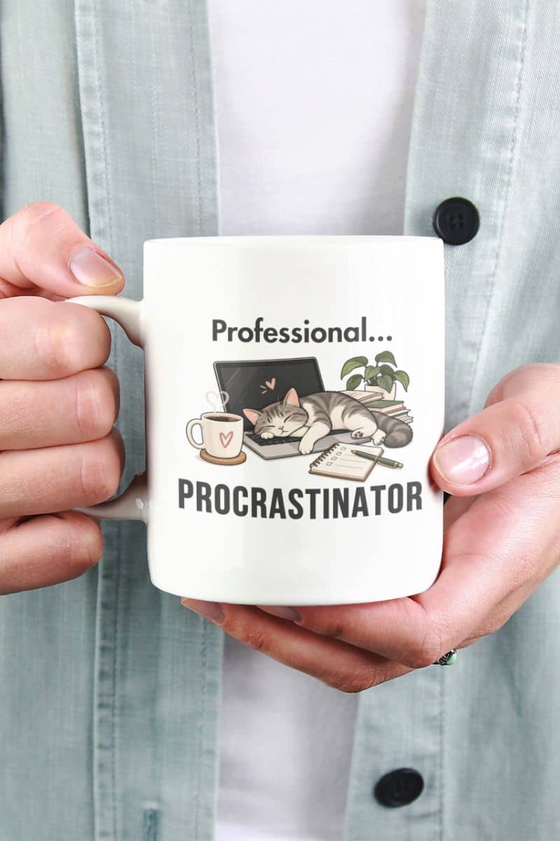 remote work mug with a person holding a white ceramic mug with a 'Professional Procrastinator' design